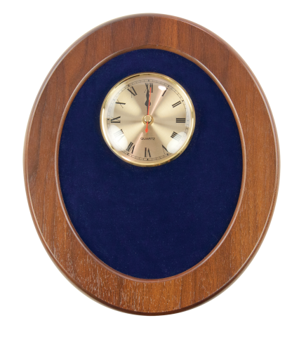 Solid walnut oval frame with rich velvet backing accents 4” quartz clock and brass engraved plate.