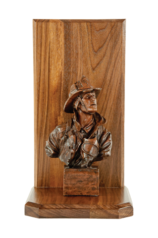 The Original Firefighter sculpture mounted on a walnut base with engraving plate