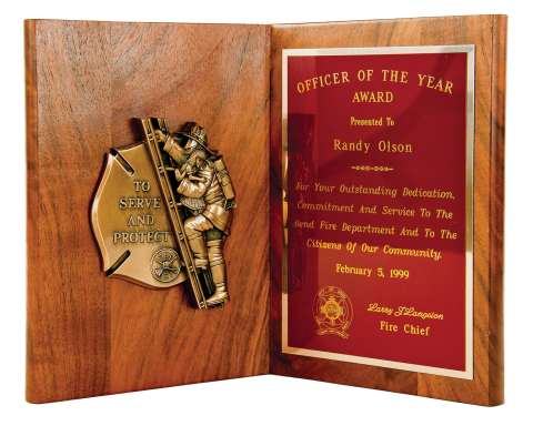 Solid walnut book plaque 9 ½” high with bronze finish “To Serve and Protect” casting and brass engraving plate